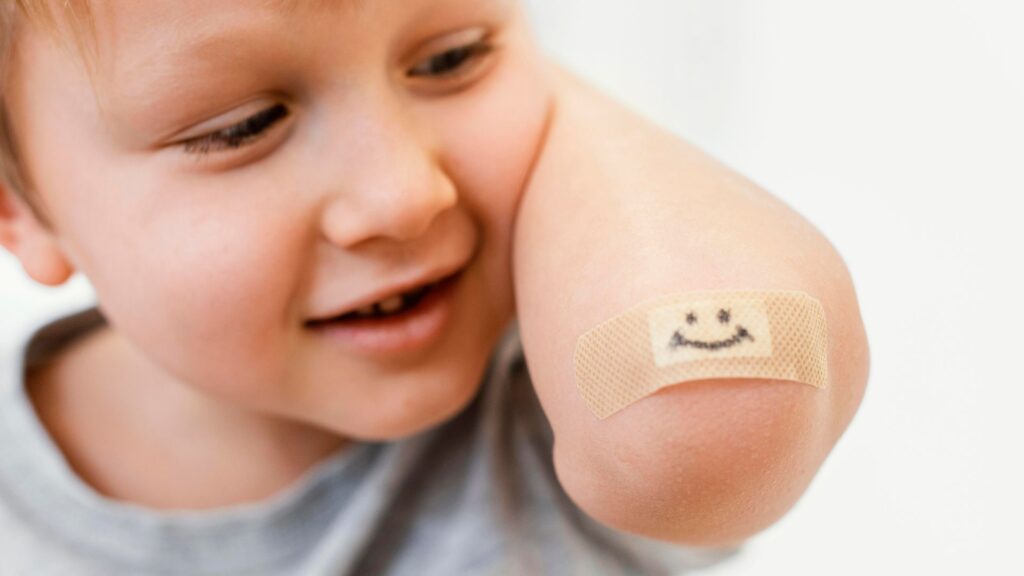Kind mit Pflaster