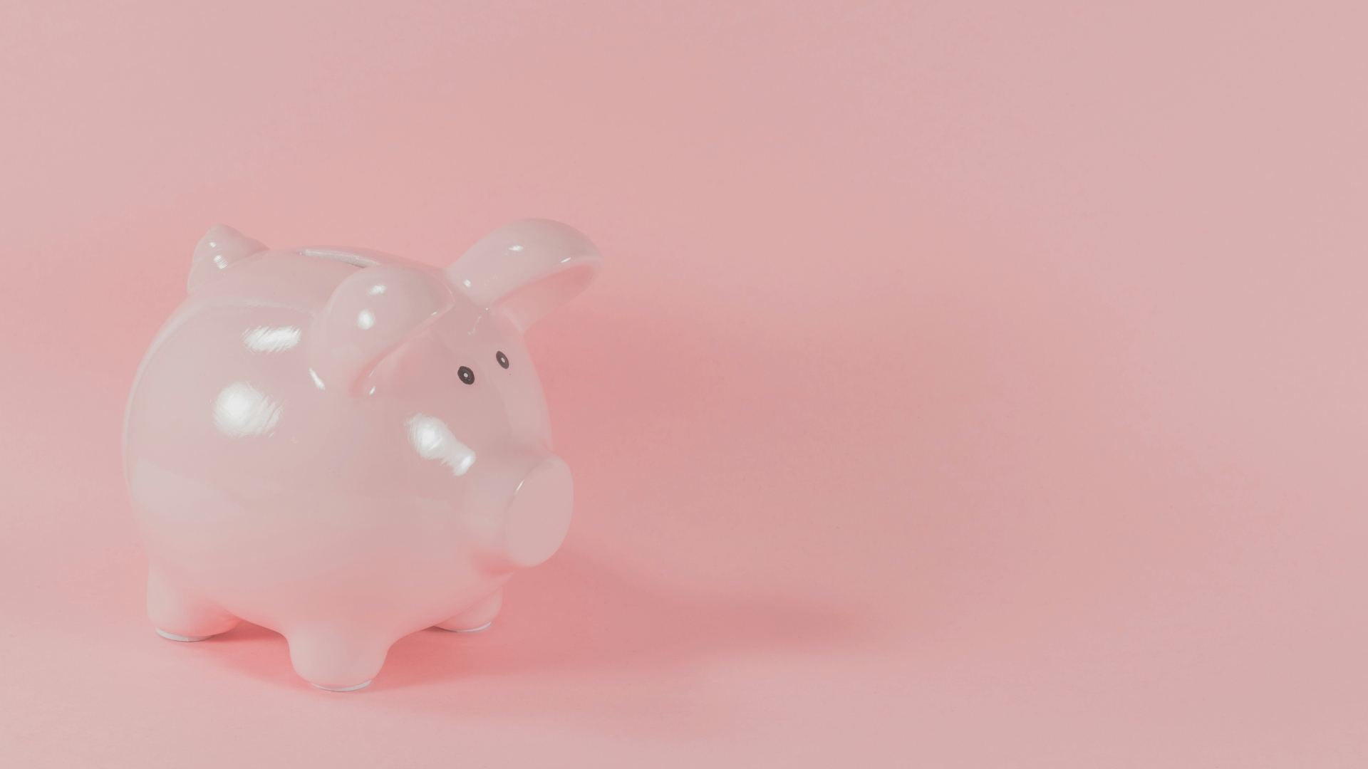 Rosa Sparschwein auf rosa Hintergrund